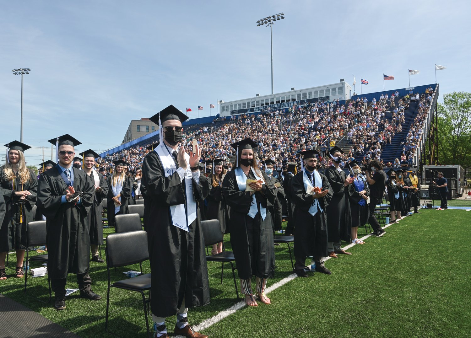 University of Rhode Island graduates from the College of Arts and Sciences celebrate their accomplishments on a beautiful day in May 2021 at Meade Stadium.